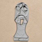 Gray dog recovery suit laid flat, showing the full-body onesie design and adjustable fit for after-surgery care